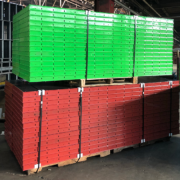 Red and green steel and birch plywood handset concrete form panels