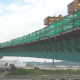 The Bridge Overhang Bracket adjusts to fit both structural steel and precast concrete beams