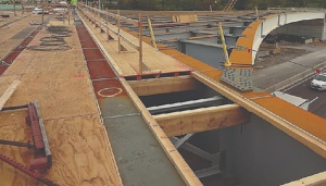 Exterior and interior hangers are used for bridge deck concrete forming 